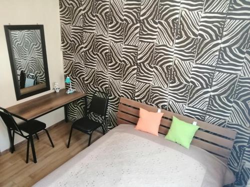 Postel nebo postele na pokoji v ubytování Guest House Monshishi