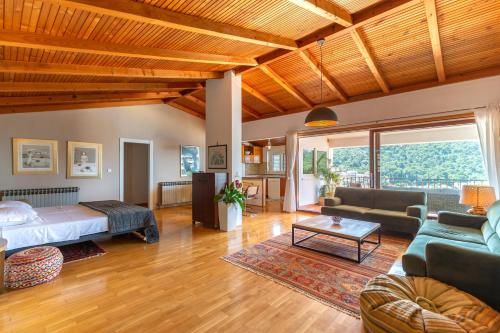 a living room with a bed and a couch at Apartments Silva in Dubrovnik