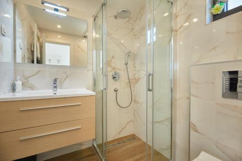 a bathroom with a shower and a sink at Apartments Silva in Dubrovnik