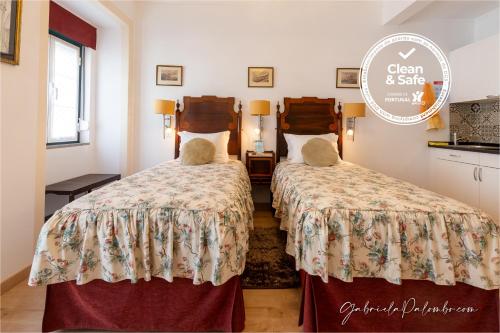 A bed or beds in a room at Discovery Apartment Estrela