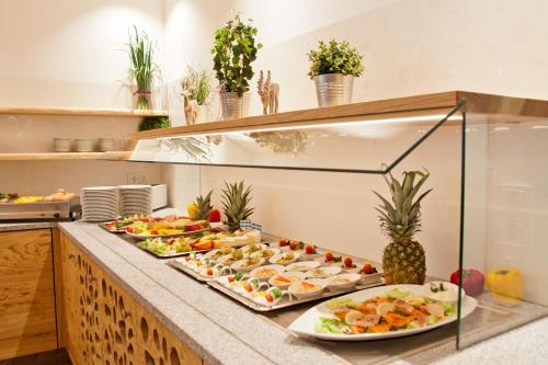 a buffet line with many plates of food at Hotel Zur Post in Ismaning