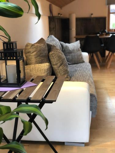 a living room with a couch and a coffee table at Zur Weberei in Bad Tölz