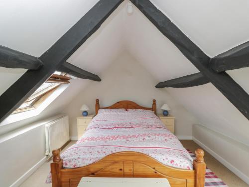 Кровать или кровати в номере Athelstan Cottage