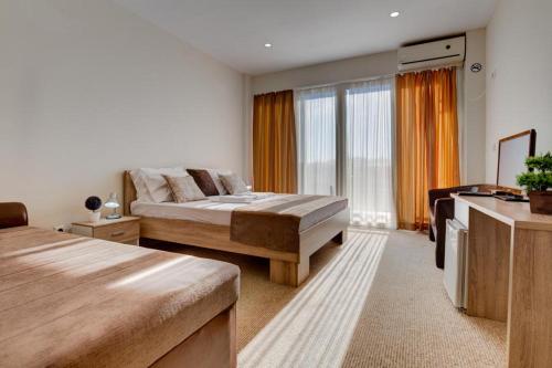 Postel nebo postele na pokoji v ubytování Hotel Zan