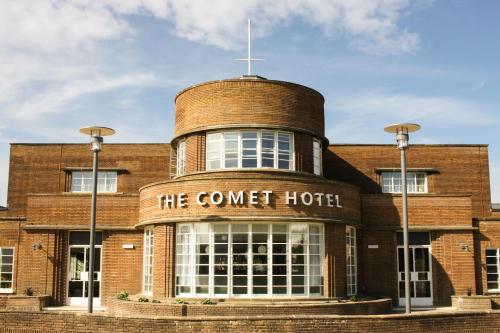 a brick building with a clock on the front of it at The Comet London Hatfield in Hatfield