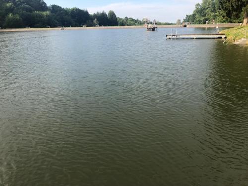 a lake with a dock in the middle of it at Villa Rafael in Forchtenau