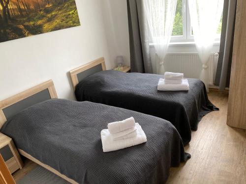 Ein Bett oder Betten in einem Zimmer der Unterkunft Apartmány Krupka
