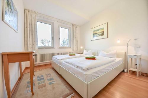 En eller flere senge i et værelse på Villa Darja Wohnung 13