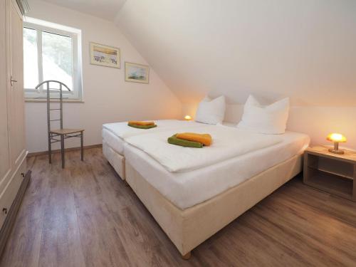 Ein Bett oder Betten in einem Zimmer der Unterkunft Ferienhaus Birgit
