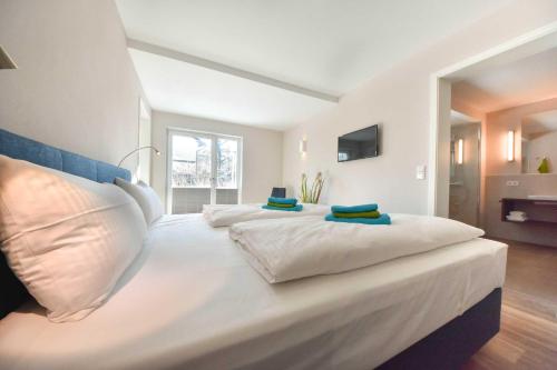 เตียงในห้องที่ Haus Seven Seas - Wohnung Arktik