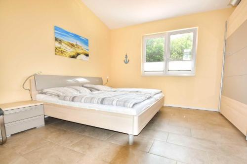 A bed or beds in a room at Appartement Sonnenhof I