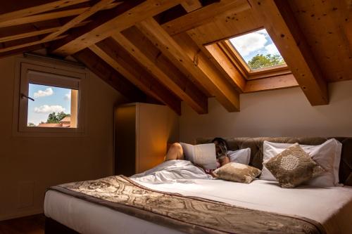 Postelja oz. postelje v sobi nastanitve Villa del Poggio Prosecco Bike Hotel