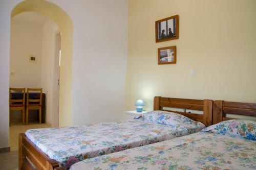 Ένα ή περισσότερα κρεβάτια σε δωμάτιο στο Cycladic houses in rural surrounding 4