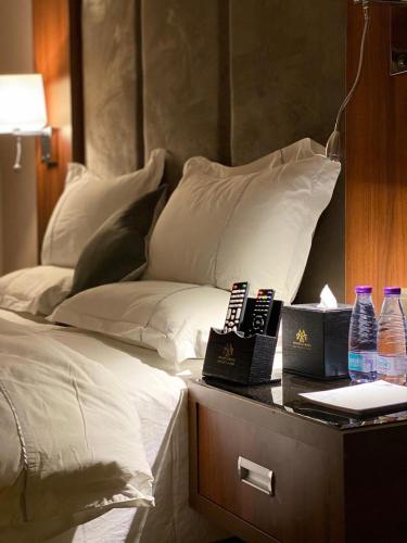 Postel nebo postele na pokoji v ubytování Msharef Almoden Serviced Apartment