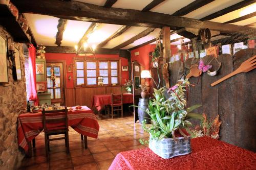 a restaurant with a table and chairs in a room at CASA RURAL Urruska in Elizondo
