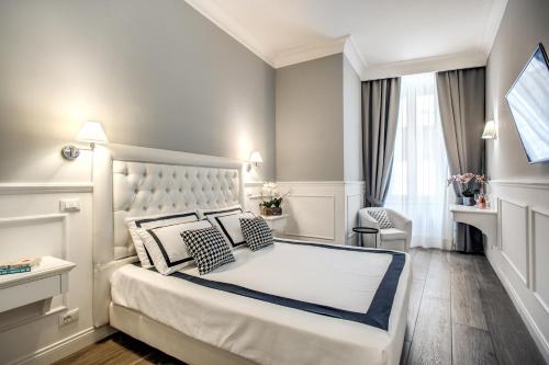 Een bed of bedden in een kamer bij Just for us - Piazza di Spagna