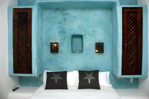 Posteľ alebo postele v izbe v ubytovaní Hostal Extramuros