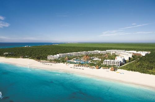 
a beach scene with a large body of water at Secrets Maroma Beach Riviera Cancun - Adults only in Playa del Carmen

