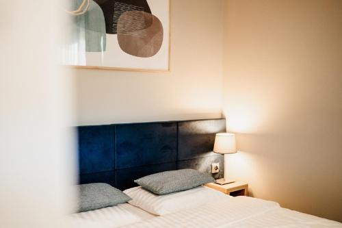 Posteľ alebo postele v izbe v ubytovaní Róża Rooms