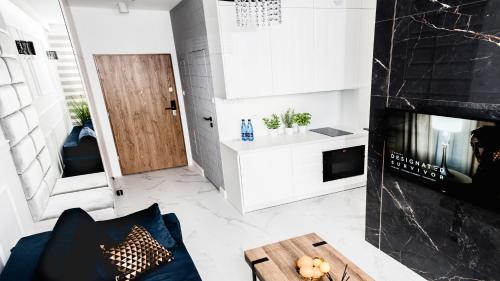 Televízia a/alebo spoločenská miestnosť v ubytovaní Hypnotize Apartment Glamour