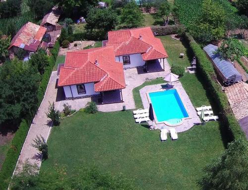 an aerial view of a house with a swimming pool at Madara OMAYA Guest House in Madara