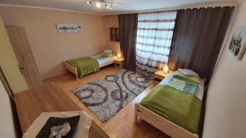 En eller flere senge i et værelse på Lattore Ferienwohnung