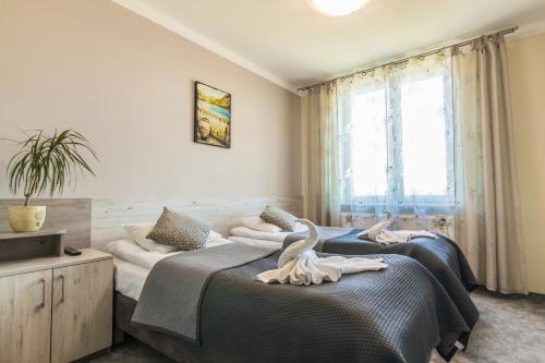 Postel nebo postele na pokoji v ubytování Resident Rene