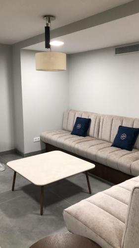 a living room with a couch and a coffee table at Hotel Lima - Adults Recommended in Marbella