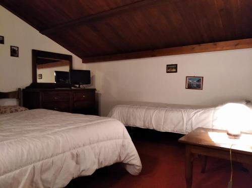 Ein Bett oder Betten in einem Zimmer der Unterkunft Albergo Martinet