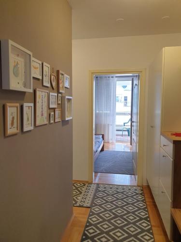 a hallway with a door leading to a living room at Stan na dan "Irina" Banja Luka in Banja Luka