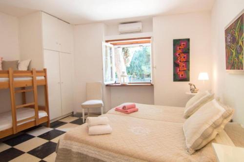 A bed or beds in a room at Seafront Villa Aggeliki