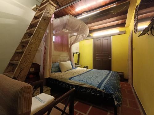 a bedroom with a bunk bed and a ladder at 彼岸古厝民宿-包棟優先--Biiann B&B in Jinning