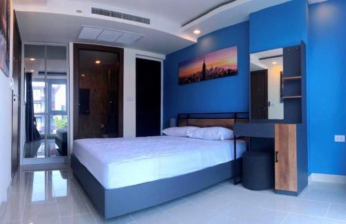 Postel nebo postele na pokoji v ubytování Grand Avenue Soi Buakhao By Daisy Pattaya