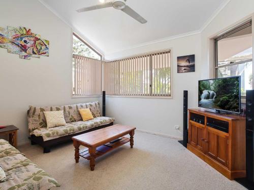 A seating area at 3 'Ambleside' 9 Shoal Bay Avenue - air con, WIFI and close to the water and Shoal Bay shops