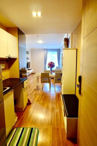a kitchen and living room with a table and a dining room at My Resort@HUA HIN A504 in Hua Hin