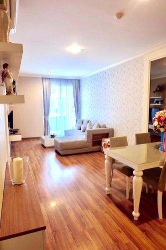 a living room with a couch and a table at My Resort@HUA HIN A504 in Hua Hin