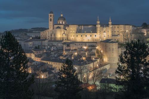 a view of a city with a large building at La casa sul ponte in Mercatello sul Metauro