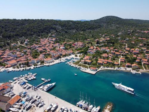an aerial view of a harbor with boats in the water at Slanac 3 in Veli Iž