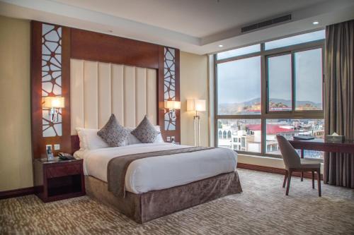 Ένα ή περισσότερα κρεβάτια σε δωμάτιο στο Sarwat Park Hotel
