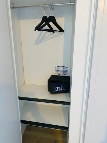a walk in closet with a microwave and a toaster at Sarlat.Catalina in Sarlat-la-Canéda