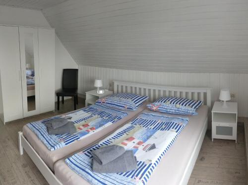 Postel nebo postele na pokoji v ubytování Pension An der Reling