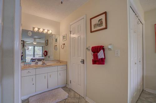 a bathroom with a sink and a mirror at Anna Maria Island Beach Bay Breeze in Bradenton Beach