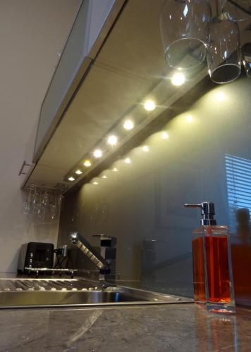 a kitchen counter with a sink and a mirror at The Gallery Accommodation McCrae in McCrae