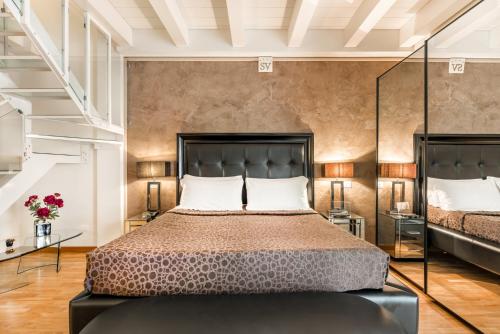 a bedroom with a large bed in a room at Hotel Stella Della Versilia in Marina di Massa