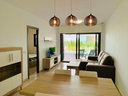 a living room with a couch and a table at Playa and Chill in San Juan de los Terreros