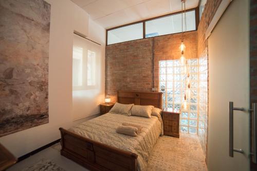 Un ou plusieurs lits dans un hébergement de l'établissement Apartamento de lujo en Gijòn