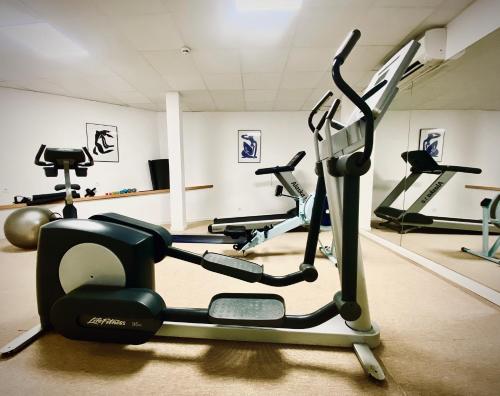 a gym with several exercise bikes in a room at Les Elmes - Hôtel & Spa in Banyuls-sur-Mer