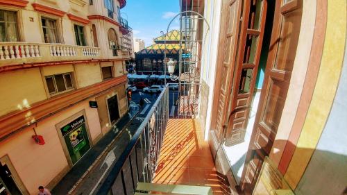 a view of a canal from a balcony of a building at The Lights Hostel in Málaga