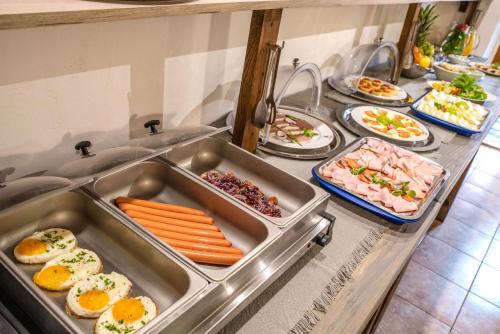 a buffet line with many different types of food at Ubytování u BÍLÉ PANÍ in Český Krumlov