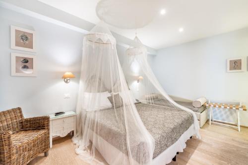 a bedroom with a bed and a dresser at Hotel Stella Della Versilia in Marina di Massa